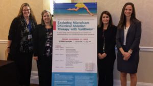 Women standing near the therapy banner