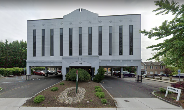 A google street view of a building with a parking lot.